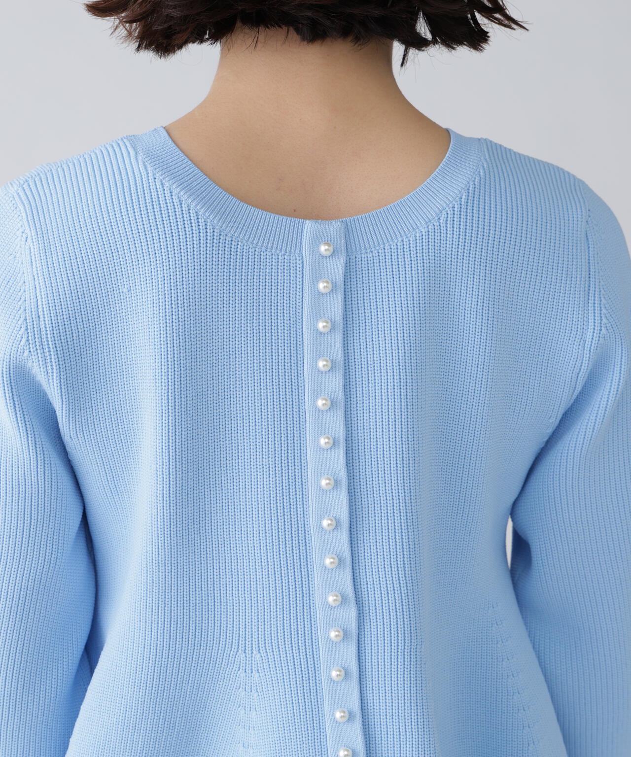 【ユーティリティ】前後で着られるペプラムフォルムニット