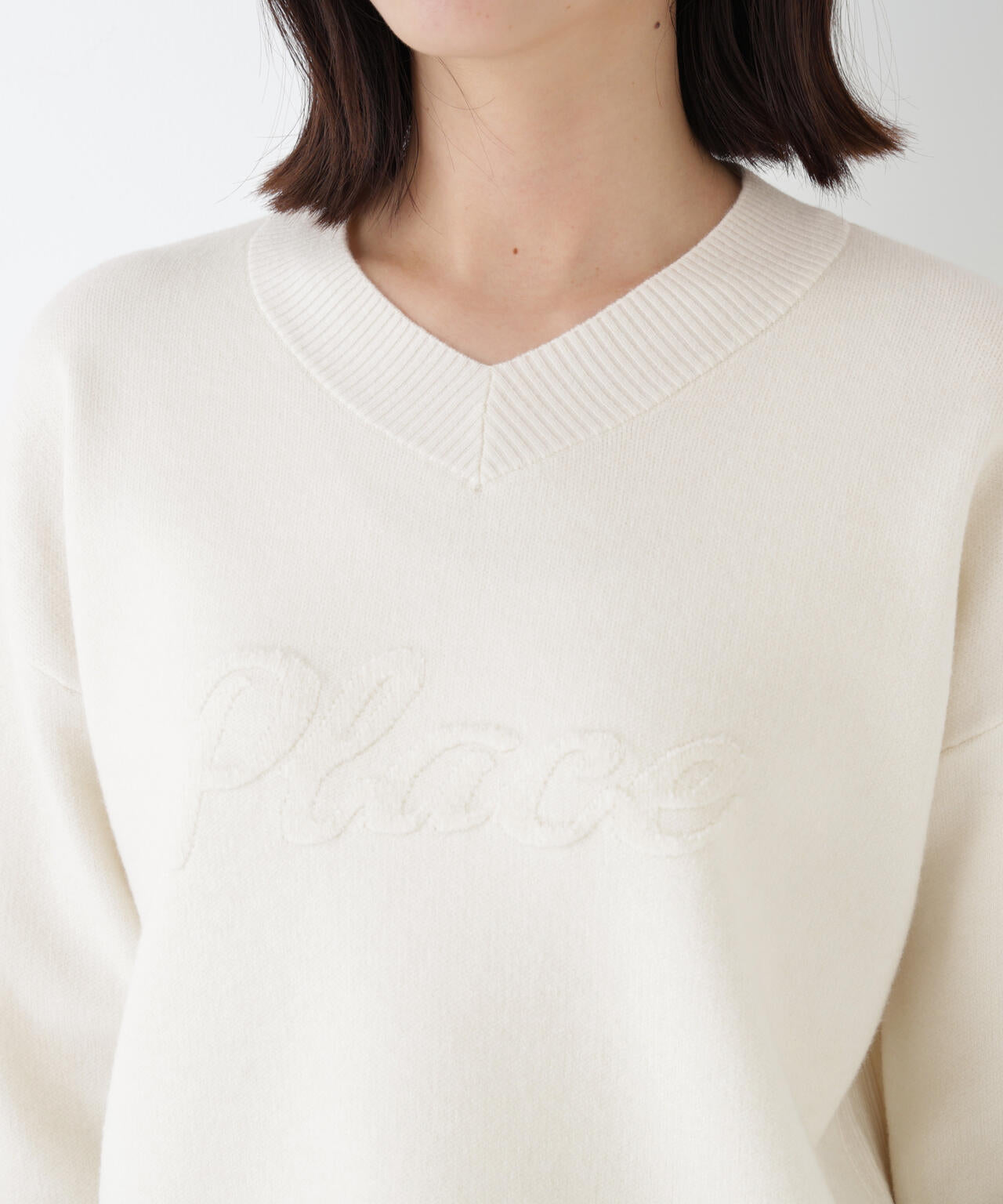 レタードジャガードVネックニット