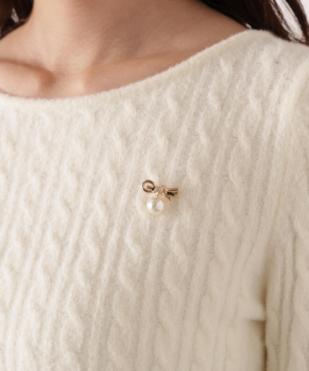 チャーム付きミニケーブルニット