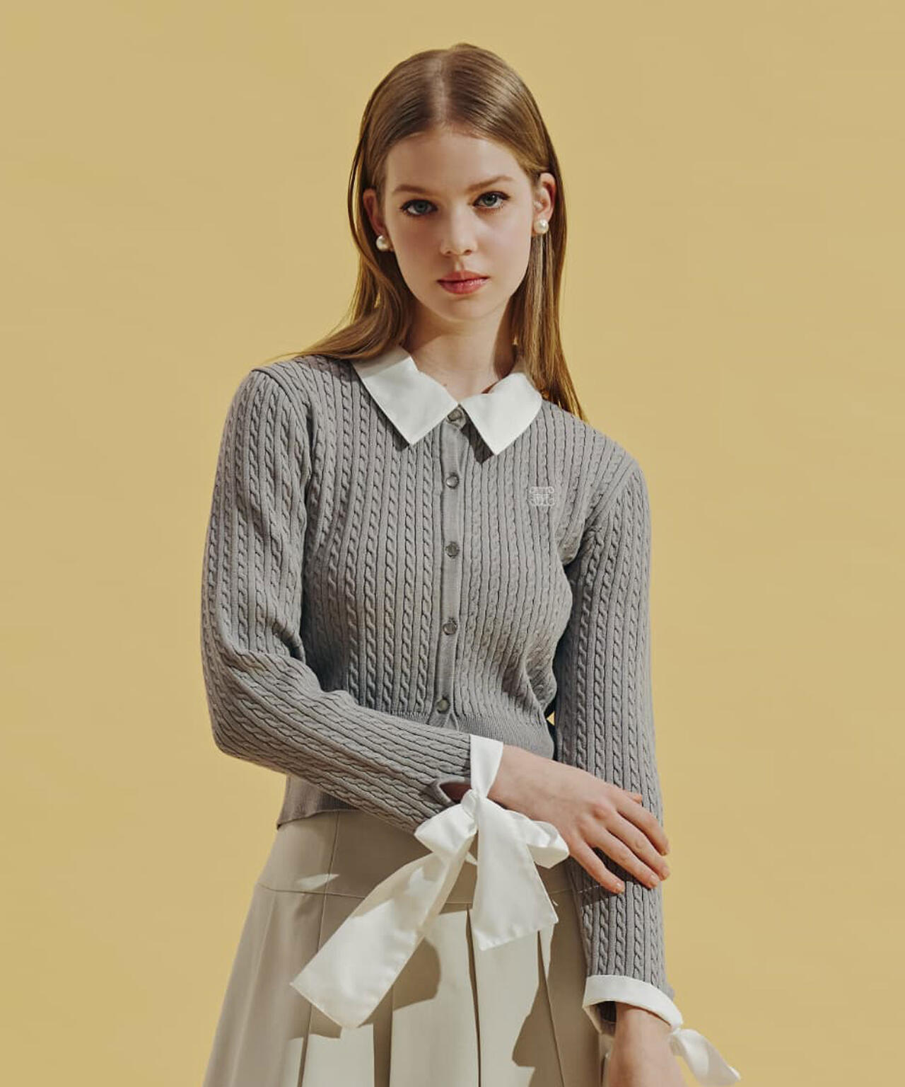 袖リボンケーブルカーディガン