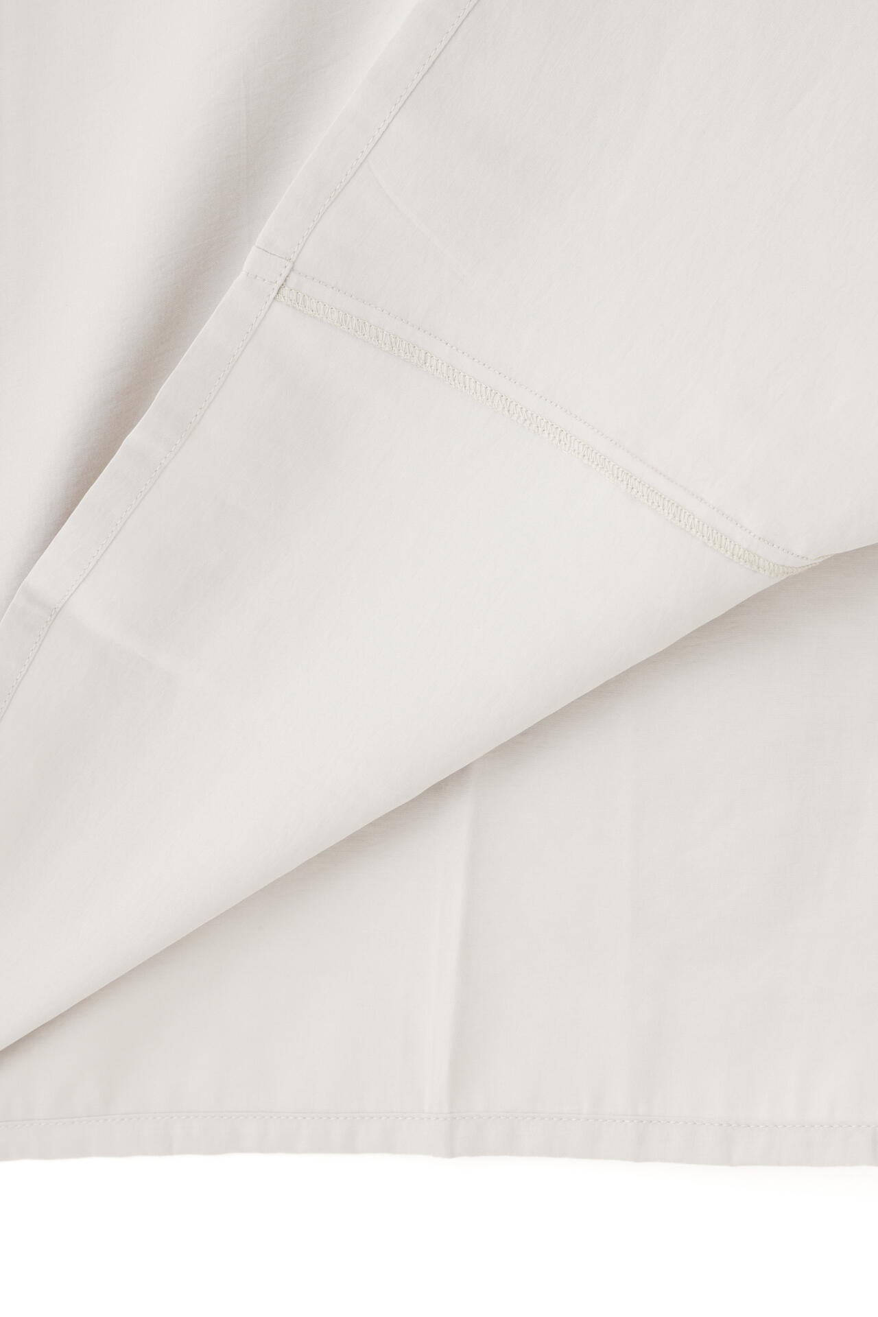 STUDIO NICHOLSON / MODAL HABOTAI ASSYMETRIC FOLD FRONT DRESS