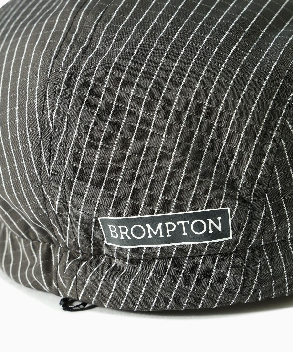 Brompton × reflective rip cap