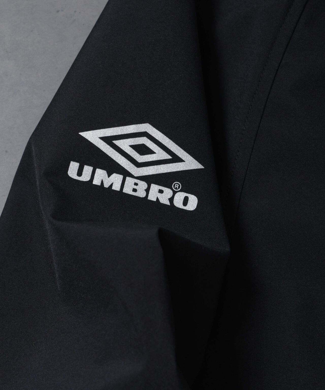 HOTEL PALACE(オテルパラス)xアンブロ スリーレイヤー撥水ドルマンオフィサーテックコート