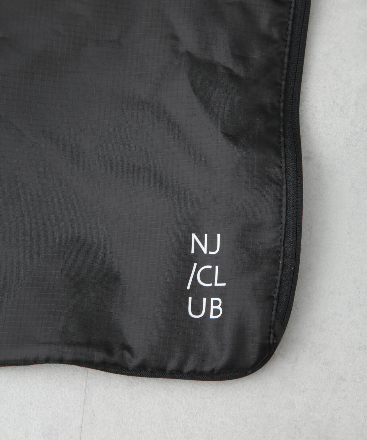 「NJ/CLUB」トラベルパッキングバッグ