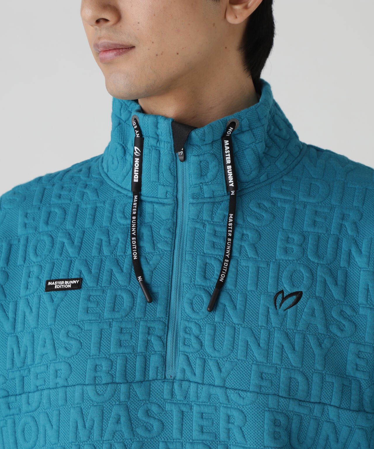 ロゴキルトジャガードハーフジップアップ