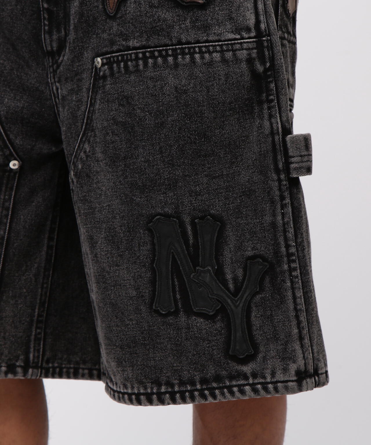 LEATHER PATCH DENIM SHORTS