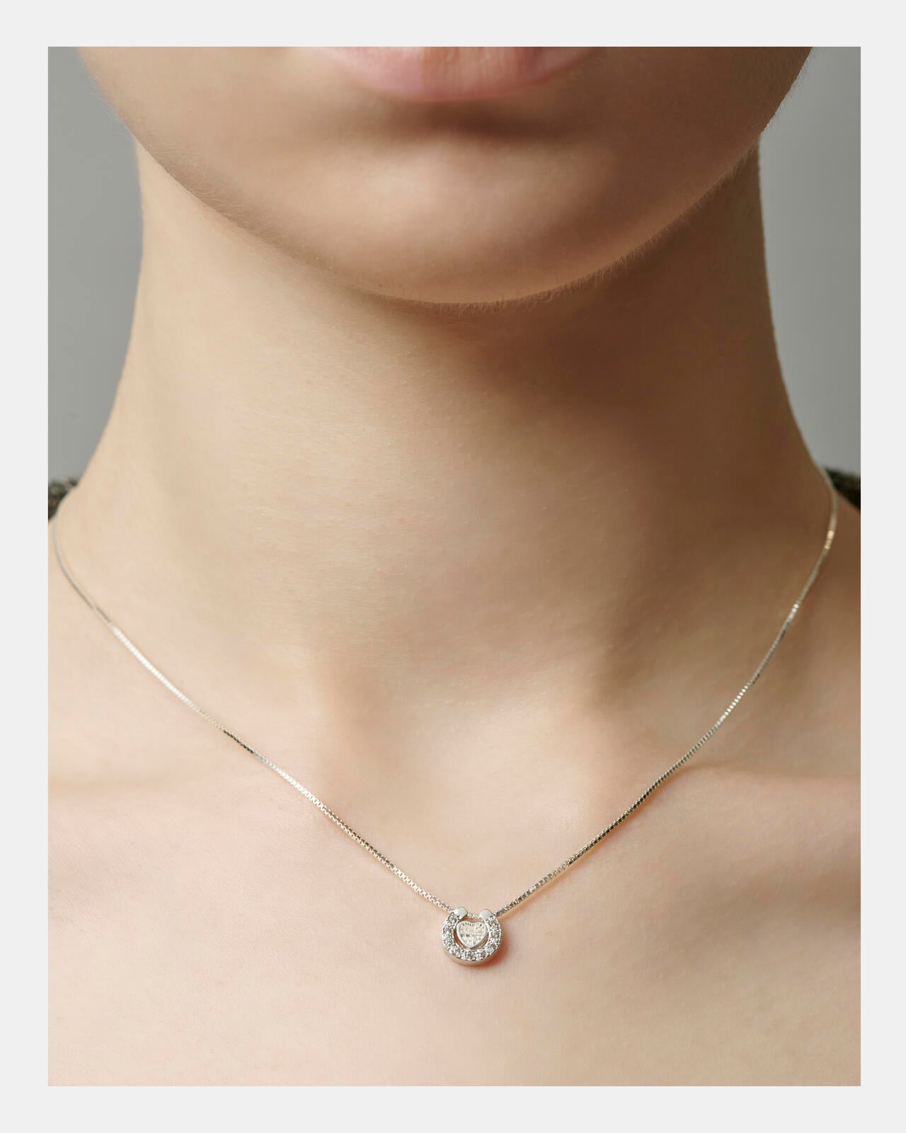 HEART HORSESHOE CZ NECKLACE(SILVER) by J.H.M CO.LTD.