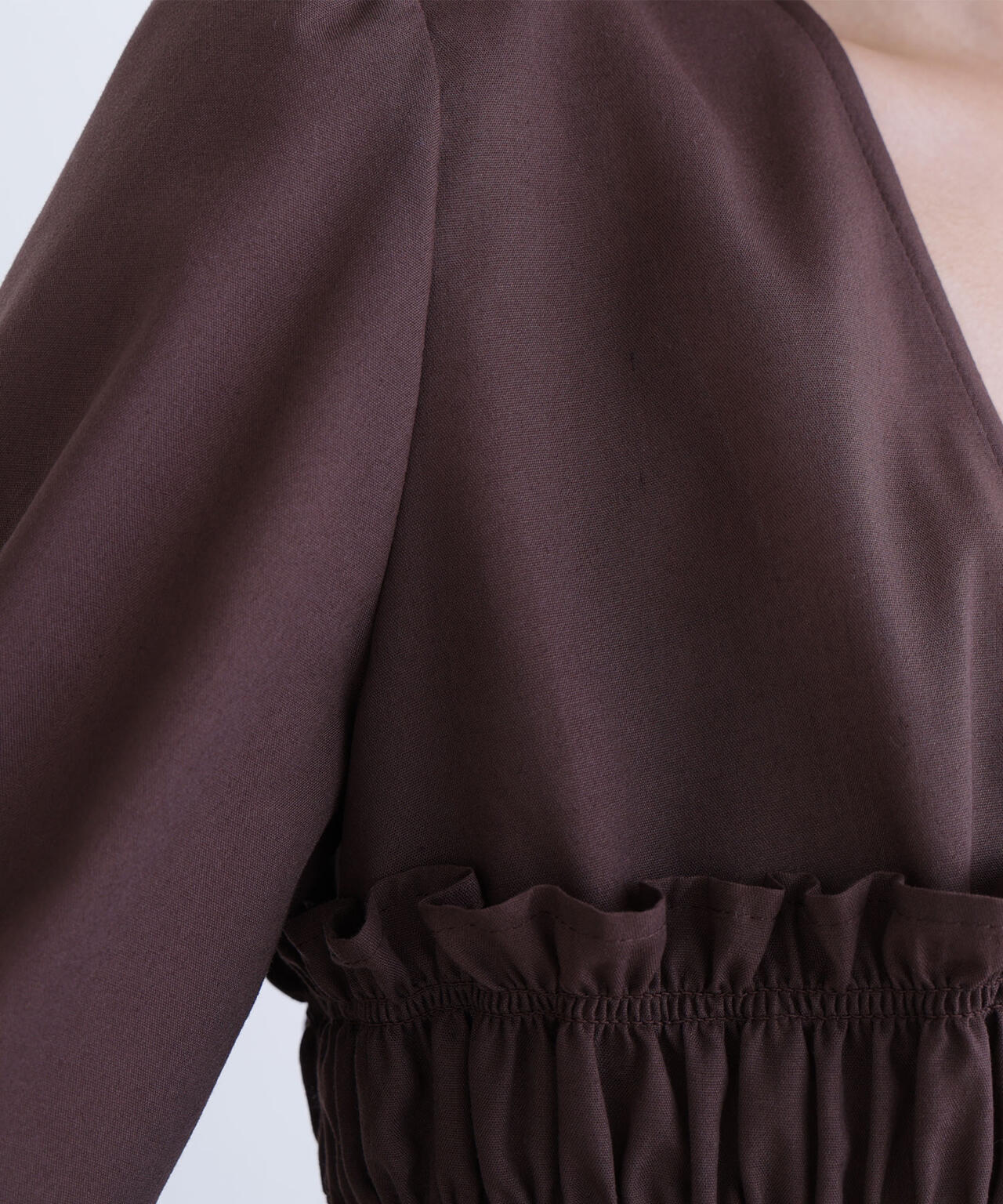 Vネックシャーリングペプラムブラウス