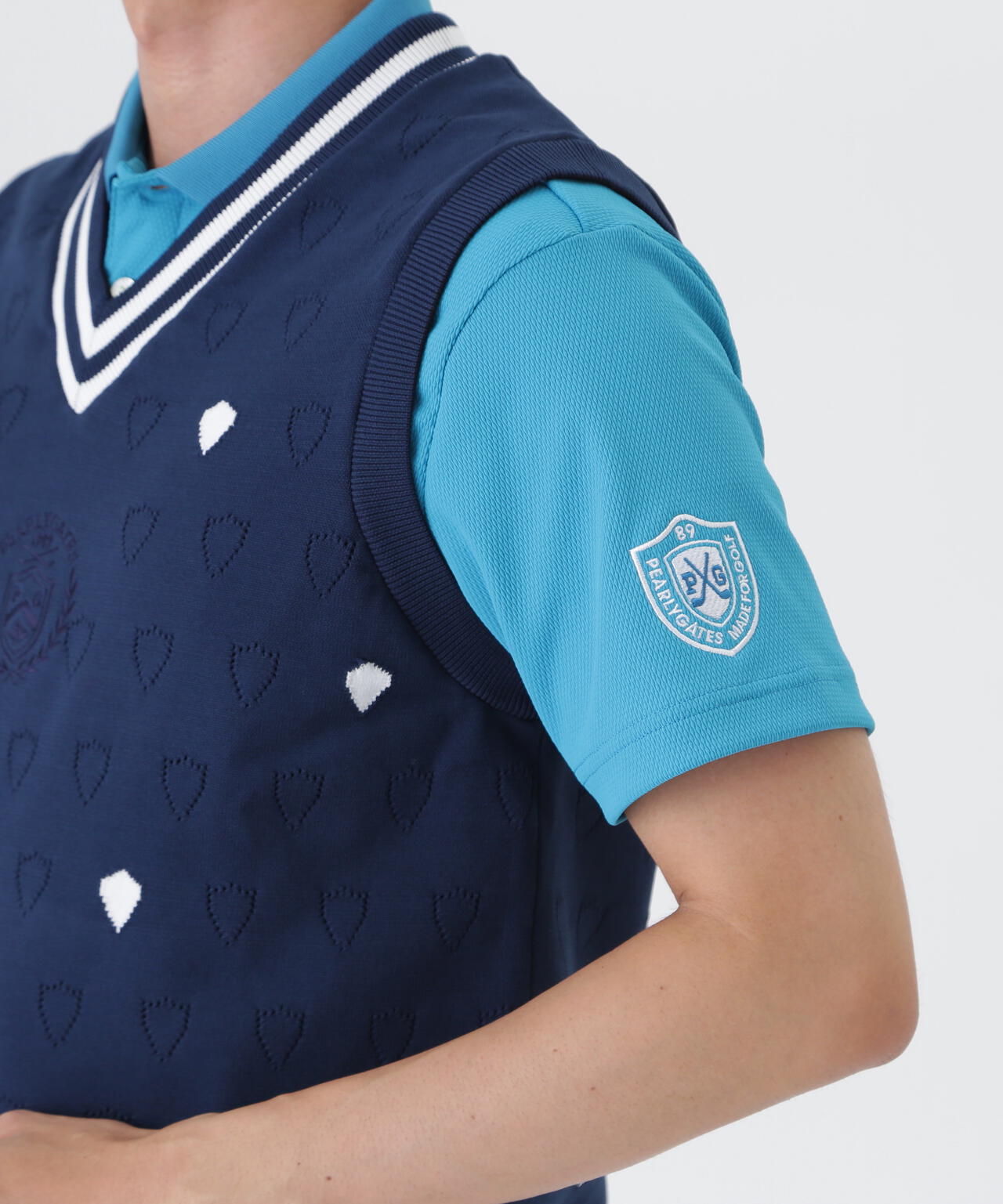 リバーシブルVネックニットベスト ＜エンブレム総柄＞ (MENS) | PEARLY