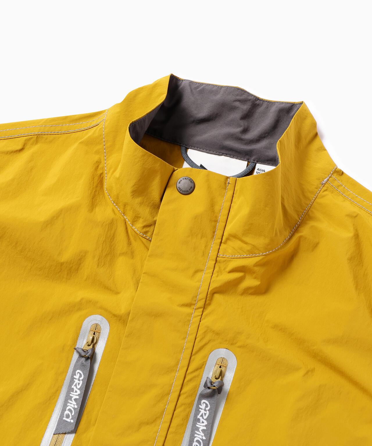 Gramicci × and wander  brushed nylon vest