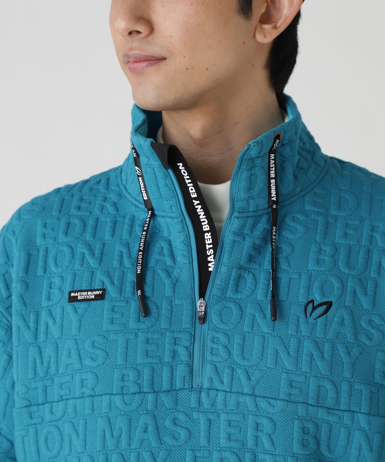 ロゴキルトジャガードハーフジップアップ