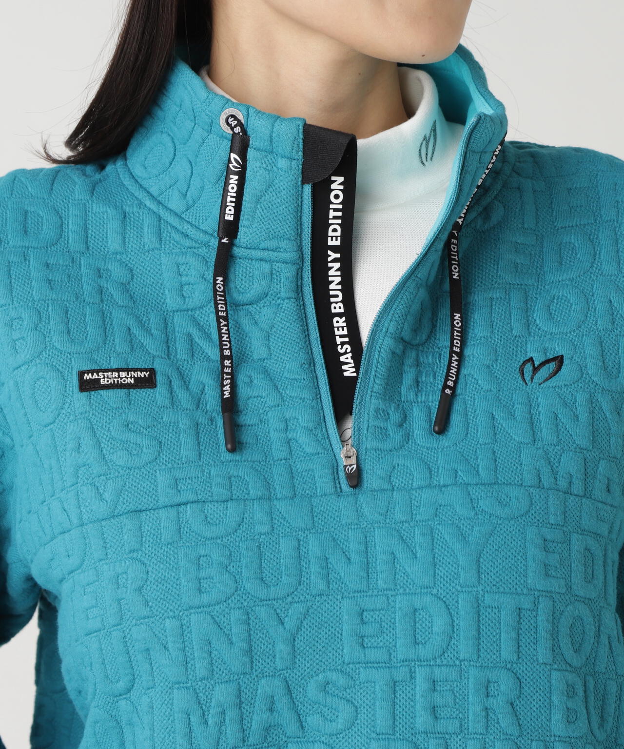 ロゴキルトジャガードハーフジップアップ